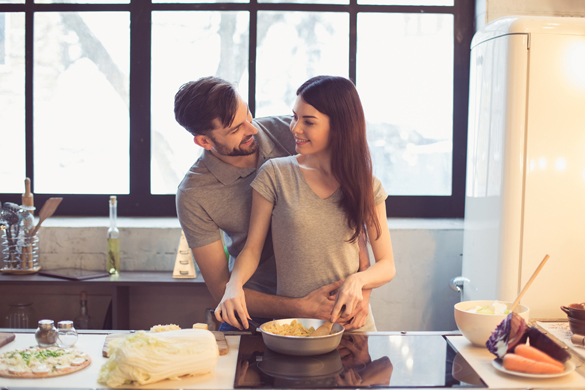 Young beautiful couple in kitchen - How To Make A Scorpio Man Propose To You