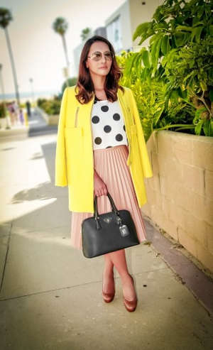 Woman wearing shirt with polka dots and skirt