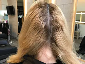 This hair is dark at the regrowth area and brassy on the lengths